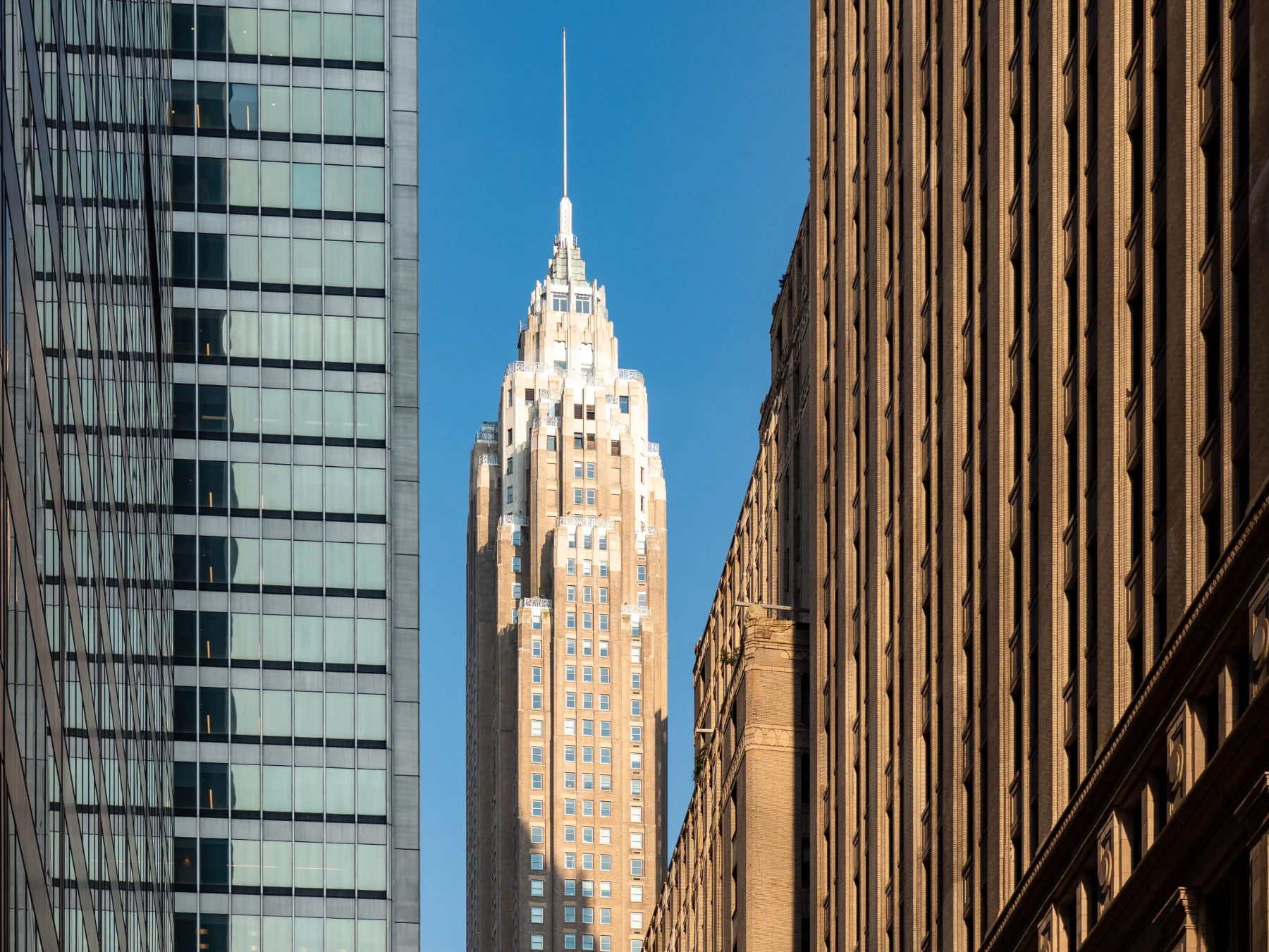 Aerial view of 70 Pine Street in New York City, United States on blue sky background Aerial view of 70 Pine Street in New York City, United States on blue sky background