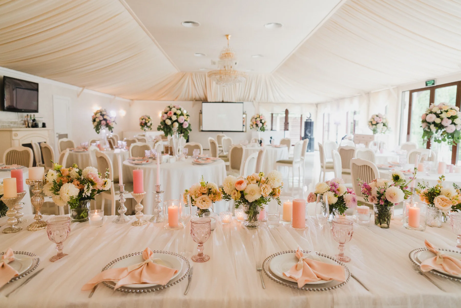 Elegant Wedding Reception Table with Flowers and Candles Elegant Wedding Reception Table with Flowers and Candles